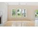 Bright living room with hardwood floors and large windows providing natural light at 489 Dolphin Dr, Summerville, SC 29485