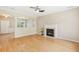 Spacious living room features a cozy fireplace, hardwood floors, and ample natural light at 489 Dolphin Dr, Summerville, SC 29485