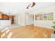 Open-concept living space with hardwood floors seamlessly connects to the kitchen and dining areas at 489 Dolphin Dr, Summerville, SC 29485