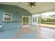 Spacious screened-in porch with outdoor access, ideal for enjoying the fresh air and peaceful surroundings at 489 Dolphin Dr, Summerville, SC 29485