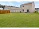 Large backyard area featuring a well-kept lawn and privacy fence, perfect for outdoor gatherings at 5003 Ferry Field Dr, Summerville, SC 29485