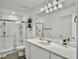Bright bathroom with a spacious shower, sleek vanity, large mirror, and elegant lighting for a modern feel at 5003 Ferry Field Dr, Summerville, SC 29485