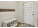 Cozy entryway with storage bench and coat rack, providing a welcoming and organized space at 5003 Ferry Field Dr, Summerville, SC 29485