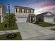 Charming two-story home with a well-manicured lawn and a two-car garage and inviting entrance at 5003 Ferry Field Dr, Summerville, SC 29485