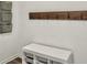 Hallway featuring a white storage unit and wooden coat rack against a white wall at 5003 Ferry Field Dr, Summerville, SC 29485