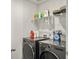 Efficient laundry room features modern LG washer and dryer, complemented by storage shelving for detergents and supplies at 5003 Ferry Field Dr, Summerville, SC 29485