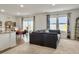 Bright open-concept living room with a large sectional sofa and plenty of natural light at 5003 Ferry Field Dr, Summerville, SC 29485