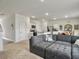Open-concept living room featuring a large sectional sofa with an eat-in kitchen nearby at 5003 Ferry Field Dr, Summerville, SC 29485