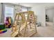Bright playroom with a wooden playset and carpeted floors at 5003 Ferry Field Dr, Summerville, SC 29485