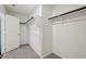Empty walk-in closet with neutral carpet, minimal shelving and an open door at 5003 Ferry Field Dr, Summerville, SC 29485