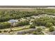 Aerial view of a property close to a river, surrounded by trees, roads and commercial buildings at 506 Arlington Dr # F, Charleston, SC 29414