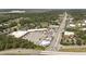Aerial view of a commercial area with shopping centers, highways, and greenery nearby at 506 Arlington Dr # F, Charleston, SC 29414