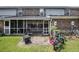 This backyard includes a patio with furniture, bike, and grass at 506 Arlington Dr # F, Charleston, SC 29414