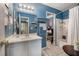 Cozy bathroom with a blue color scheme, vanity, and a bathtub shower combo at 506 Arlington Dr # F, Charleston, SC 29414