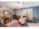 A relaxing bedroom with a vintage design aesthetic including floral wallpaper and a ceiling fan at 506 Arlington Dr # F, Charleston, SC 29414