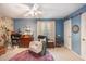 Bedroom featuring floral wallpaper, a dart board, and a comfy rocking chair by the window at 506 Arlington Dr # F, Charleston, SC 29414