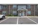 Brick two-story townhouse featuring a well-manicured lawn and convenient parking at 506 Arlington Dr # F, Charleston, SC 29414