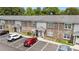 Exterior view of community with assigned parking, tidy landscape, and building facade at 506 Arlington Dr # F, Charleston, SC 29414