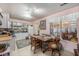 Charming kitchen with pink walls, a dining table set for a meal, and a window view at 506 Arlington Dr # F, Charleston, SC 29414