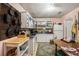 A view of the kitchen showing the dining table, countertops, white cabinetry, and appliances at 506 Arlington Dr # F, Charleston, SC 29414