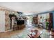 Inviting living room featuring unique wall decor, wood floors and staircase at 506 Arlington Dr # F, Charleston, SC 29414