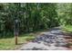 Community walking path with a sign that includes a map of the trail system at 506 Arlington Dr # F, Charleston, SC 29414