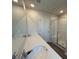 Modern bathroom featuring double vanity with quartz countertop, a framed glass shower, and wood-look flooring at 5100 Double Eagle, Summerville, SC 29485