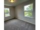 Bedroom featuring carpet, a window, and views of the neighborhood at 5100 Double Eagle, Summerville, SC 29485