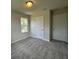Bedroom featuring carpet, a window, and two doors at 5100 Double Eagle, Summerville, SC 29485