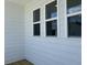 Exterior view of the home showcasing horizontal siding and modern white windows at 5100 Double Eagle, Summerville, SC 29485