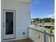 View from patio looking out to parking and trees with white railings at 5100 Double Eagle, Summerville, SC 29485