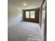 Unfinished room with two windows and basic ceiling light fixture at 5100 Double Eagle, Summerville, SC 29485