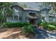 Inviting condo with well-maintained landscaping and classic wood facade beneath a canopy of mature trees at 5504 Green Dolphin Way, Kiawah Island, SC 29455