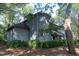 Charming condo with a classic wood facade nestled among lush greenery and towering trees at 5504 Green Dolphin Way, Kiawah Island, SC 29455