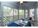 Spacious screened-in porch features comfortable seating and lovely views at 5504 Green Dolphin Way, Kiawah Island, SC 29455
