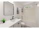 Bathroom featuring a shower-tub combo, with modern fixtures and a white vanity with a quartz counter at 569 Pointe Of Oaks Rd, Summerville, SC 29485