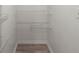 A small closet with wood look floors and white walls, with wire shelving for storage at 569 Pointe Of Oaks Rd, Summerville, SC 29485