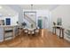 Dining Room featuring hardwood floors, stylish lighting, staircase, and open entryway at 569 Pointe Of Oaks Rd, Summerville, SC 29485