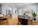 Well-lit dining area connected to the living room and kitchen, perfect for entertaining at 569 Pointe Of Oaks Rd, Summerville, SC 29485
