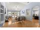 Inviting living room with fireplace, built-ins, and hardwood floors, offering access to the pool at 569 Pointe Of Oaks Rd, Summerville, SC 29485