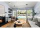 Beautiful living room with doors leading to a private pool and patio area at 569 Pointe Of Oaks Rd, Summerville, SC 29485