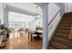 Spacious open-concept living with hardwood floors, archways, and natural light throughout home at 569 Pointe Of Oaks Rd, Summerville, SC 29485