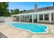 A stunning backyard pool, framed by lush greenery, perfect for relaxation and outdoor enjoyment at 569 Pointe Of Oaks Rd, Summerville, SC 29485