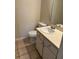 Compact bathroom with a standard vanity, toilet, and neutral tile flooring at 6 Town Park Ln # C, Charleston, SC 29412