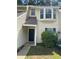 Inviting two-story home with neutral siding, complemented by mulled windows and well-maintained landscaping at 6 Town Park Ln # C, Charleston, SC 29412