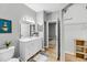 Bathroom with single sink vanity and access to walk-in closet and bedroom at 60 Fenwick Hall Aly # 415, Johns Island, SC 29455