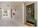 Inviting condo entrance with a welcome mat and a charming wreath on the front door at 60 Fenwick Hall Aly # 415, Johns Island, SC 29455