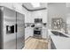 Bright kitchen with white cabinetry, stainless steel appliances, and a skylight at 60 Fenwick Hall Aly # 415, Johns Island, SC 29455