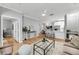 Bright, open-concept living space with light-colored walls, modern furnishings, and hardwood floors at 60 Fenwick Hall Aly # 415, Johns Island, SC 29455
