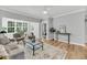 Well-lit living room with open layout, contemporary design, and an inviting view into the bedroom at 60 Fenwick Hall Aly # 415, Johns Island, SC 29455
